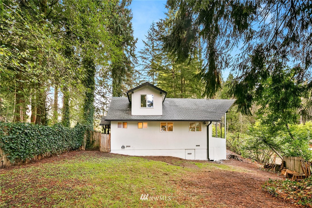 21105 West Richmond Road Bothell, WA 98021 - Photo 18 of 21 a front view of a house with a yard garage and tree