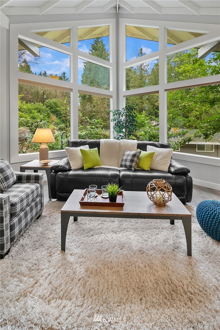 21105 West Richmond Road Bothell, WA 98021 - Photo 5 of 21 a living room with furniture and a floor to ceiling window