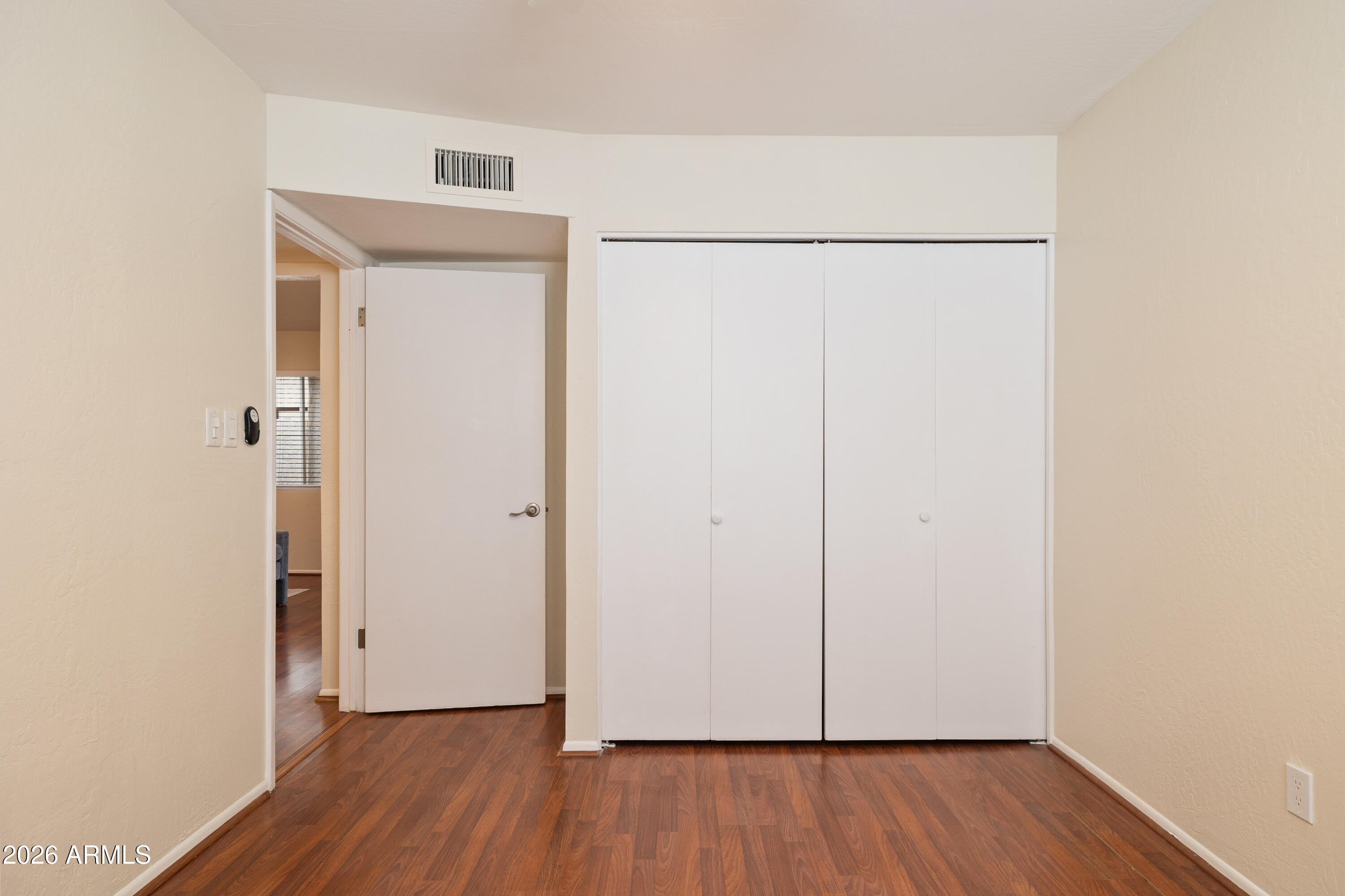 4343 East Osborn Road Phoenix, AZ 85018 - Photo 17 of 41 a view of an empty room with wooden floor