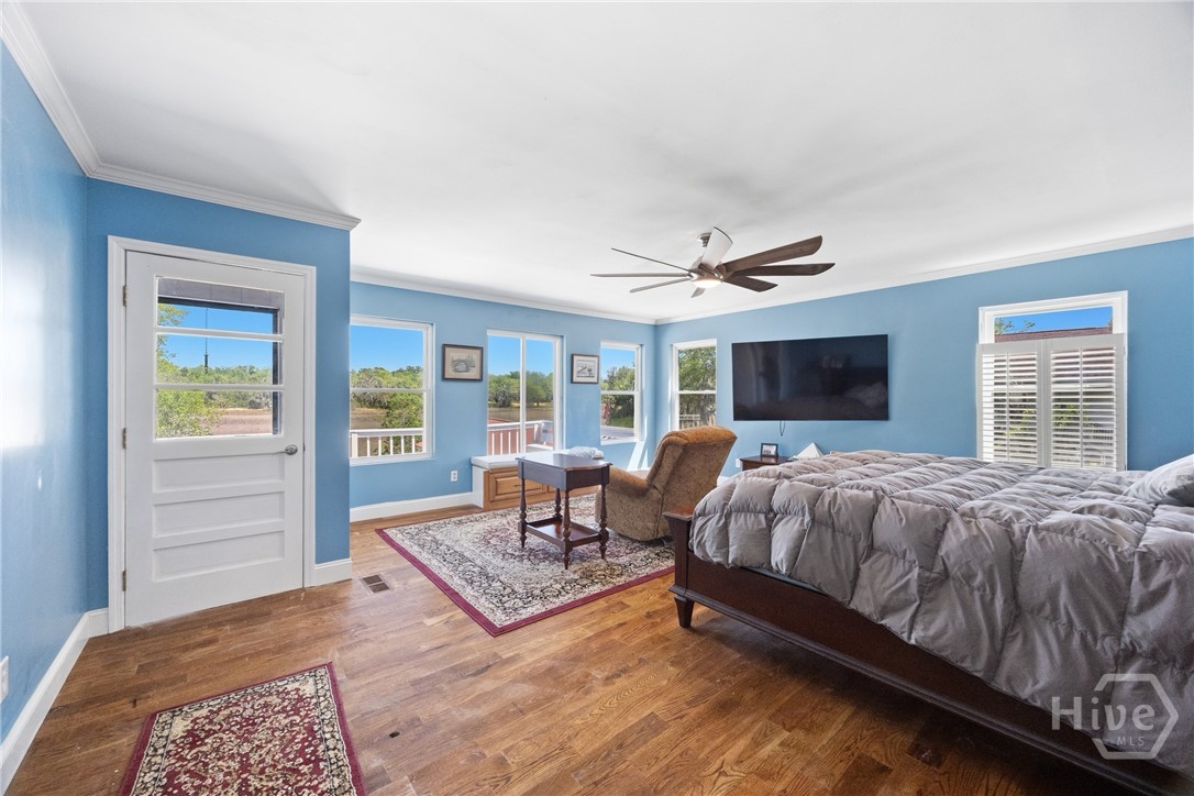 95 Circle Drive Midway, GA 31320 - Photo 13 of 29 Primary bedroom retreat with abundant natural light and peaceful views
