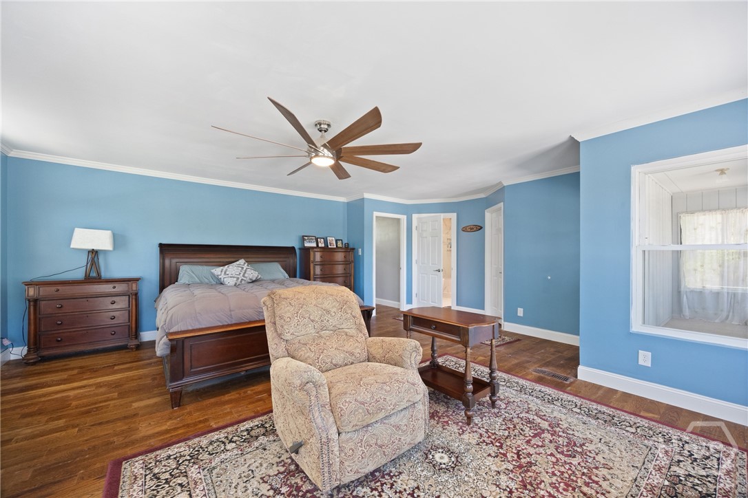 95 Circle Drive Midway, GA 31320 - Photo 14 of 29 Alternate view of the primary bedroom, highlighting generous space and flexible layout