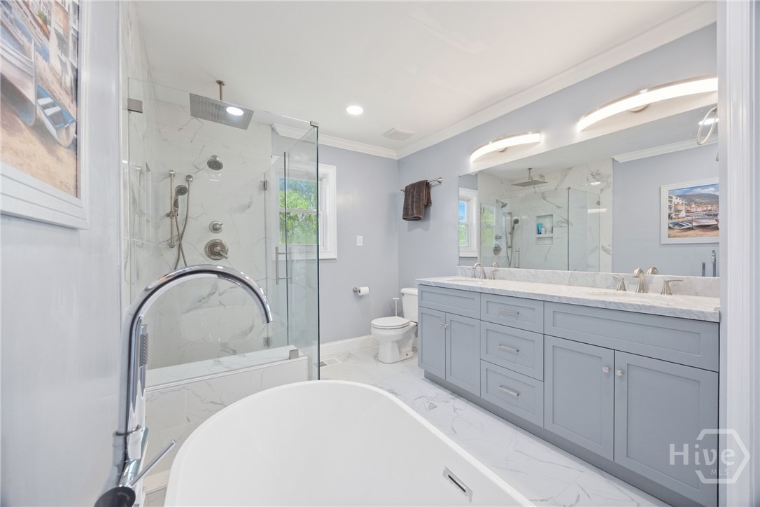95 Circle Drive Midway, GA 31320 - Photo 16 of 29 Beautifully renovated bathroom featuring a soaking tub, walk-in shower, and elegant finishes