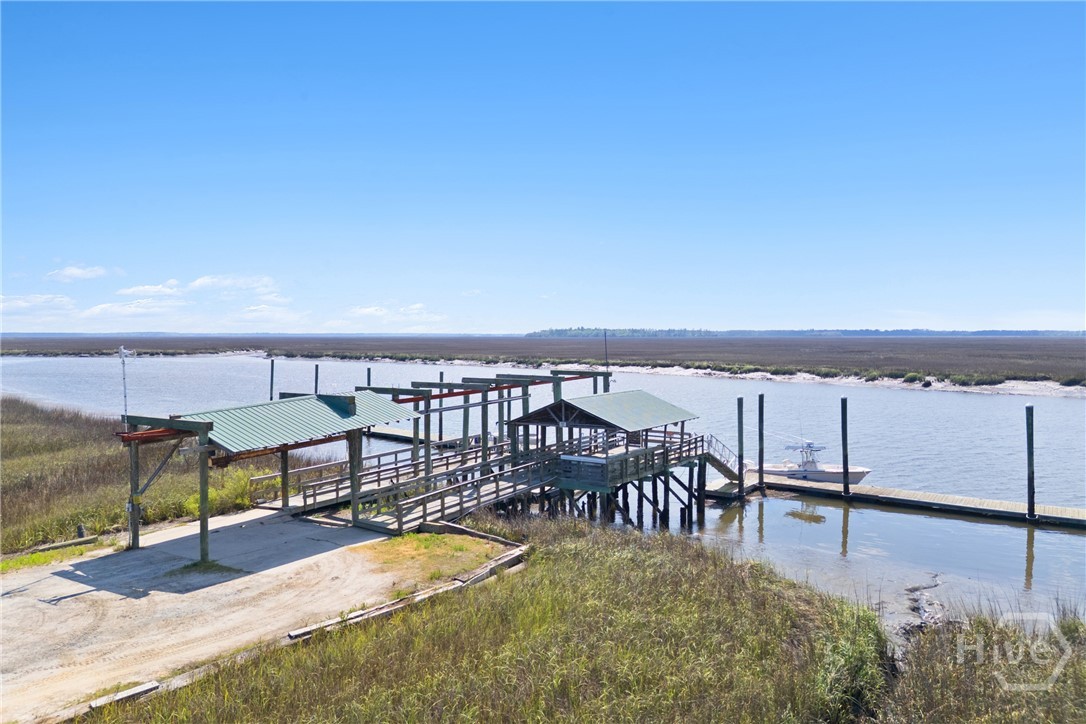 95 Circle Drive Midway, GA 31320 - Photo 25 of 29 Nearby community dock with covered area and multiple slips, providing convenient access to the water.