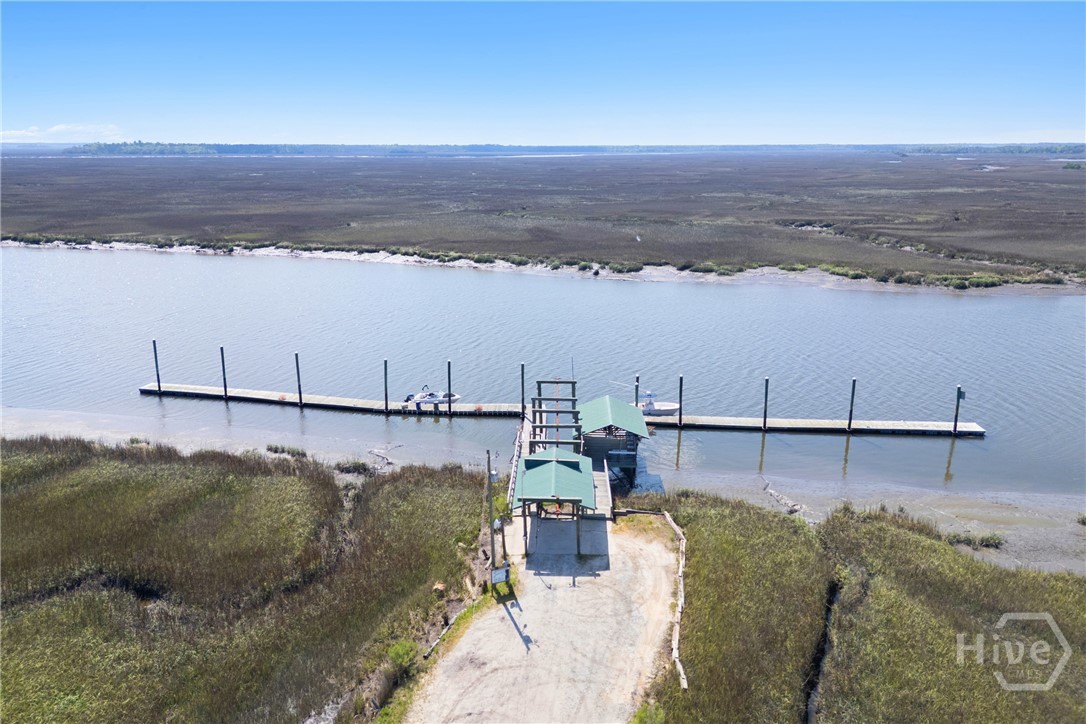 95 Circle Drive Midway, GA 31320 - Photo 26 of 29 Wide view of the dock and tidal creek, highlighting easy boating access and scenic coastal surroundings.