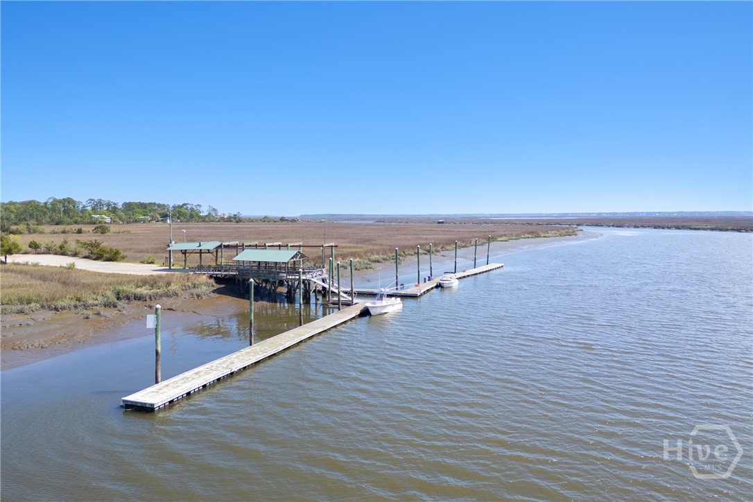 95 Circle Drive Midway, GA 31320 - Photo 27 of 29 Elevated aerial perspective of the dock and marsh, showing the peaceful, natural landscape and waterways.