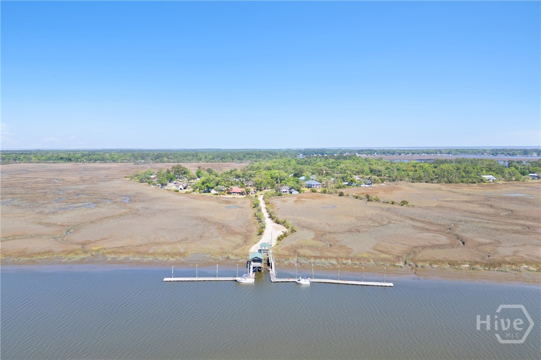 95 Circle Drive Midway, GA 31320 - Photo 28 of 29 Long-range aerial view of the neighborhood peninsula, illustrating the unique coastal setting and proximity to the water.