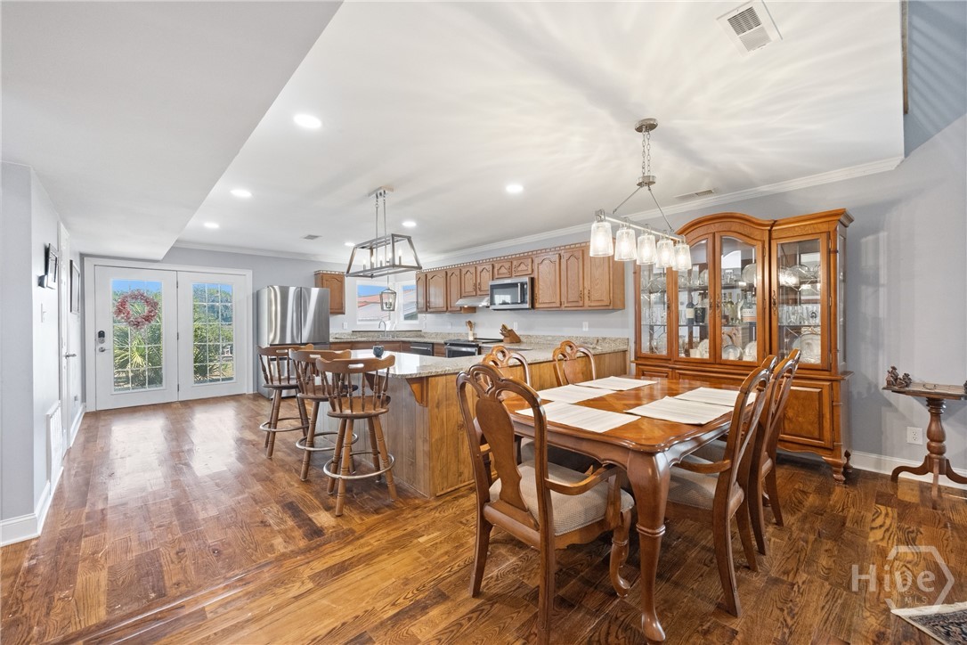 95 Circle Drive Midway, GA 31320 - Photo 7 of 29 Generous dining area connected to the kitchen, perfect for hosting and entertaining