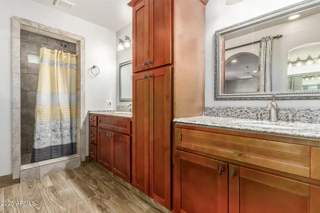 a view of a bathroom with a sink and mirror