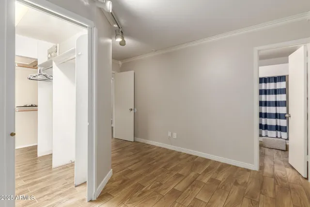 a bathroom with a sink a toilet a shower and a mirror