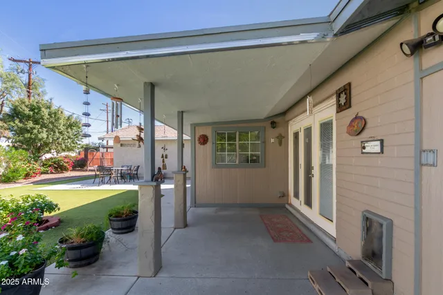 a view of a house with swimming pool and porch