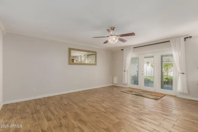 a view of an empty room with glass door