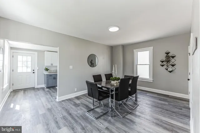 a view of a livingroom with furniture and wooden floor