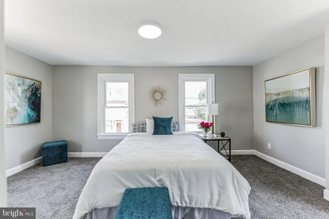 a bed room with a bed and a window