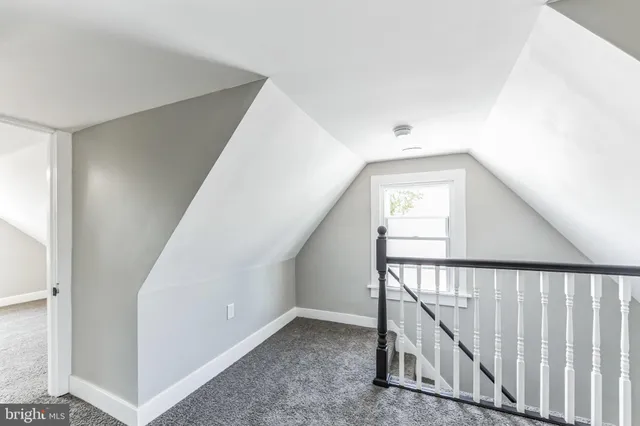 a view of a hallway with stairs