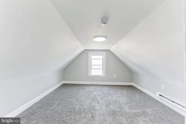 an empty room with a empty space and windows