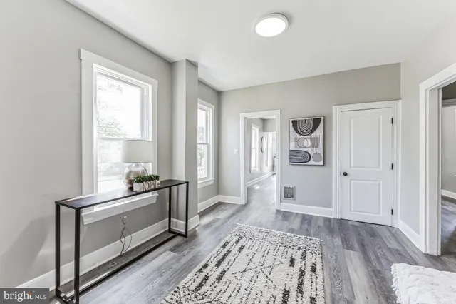 a spacious bedroom with a bed and a window