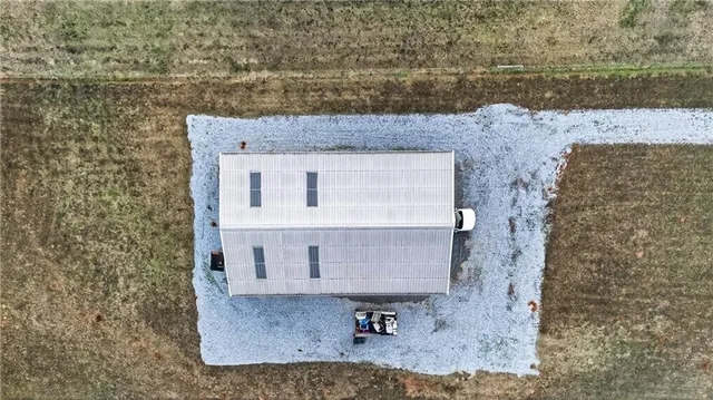 a view of a swimming pool with an outdoor space and seating area