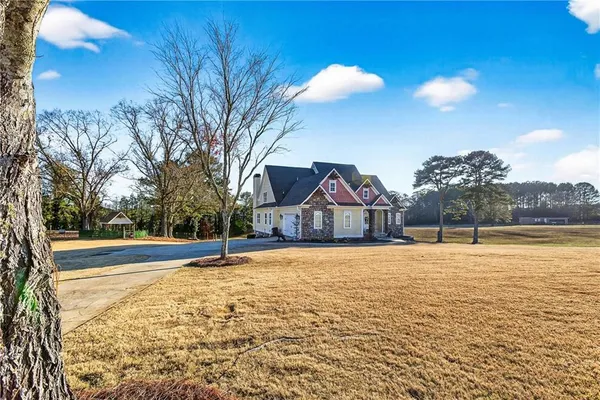 a kitchen with stainless steel appliances granite countertop a stove a refrigerator and a sink