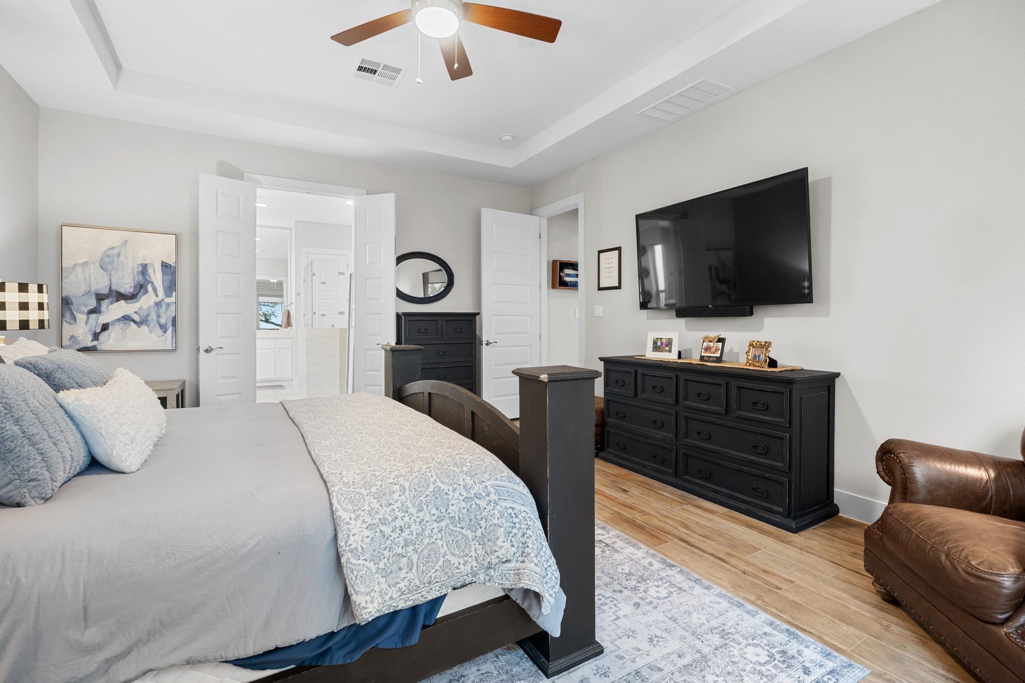 2009 Nature View Loop Driftwood, TX 78619 - Photo 13 of 40 a bedroom with a bed and a flat screen tv