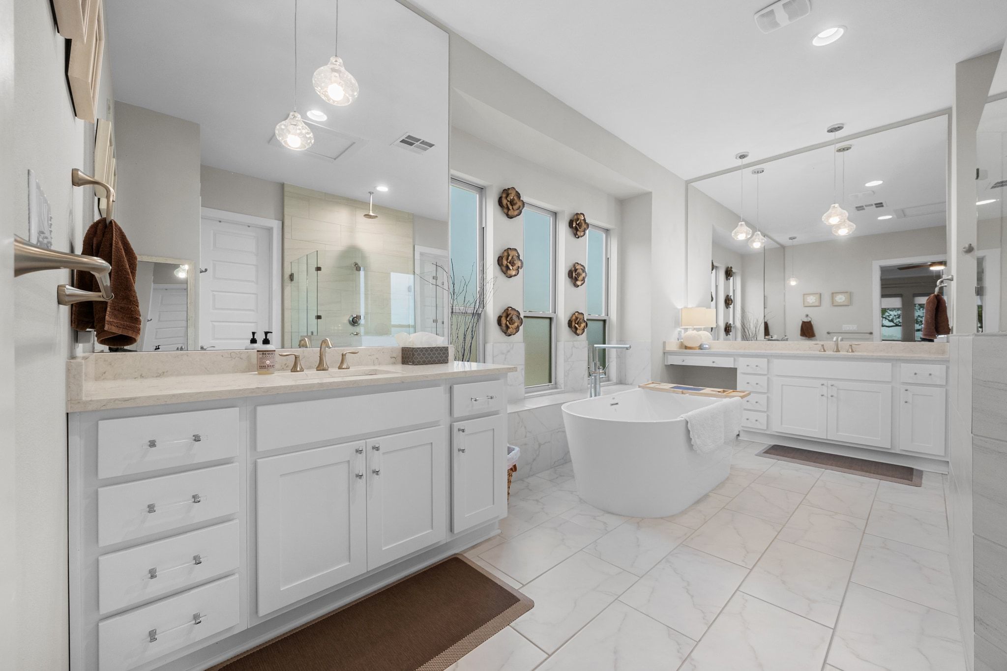 2009 Nature View Loop Driftwood, TX 78619 - Photo 14 of 40 a spacious bathroom with a double vanity sink mirror and bathtub