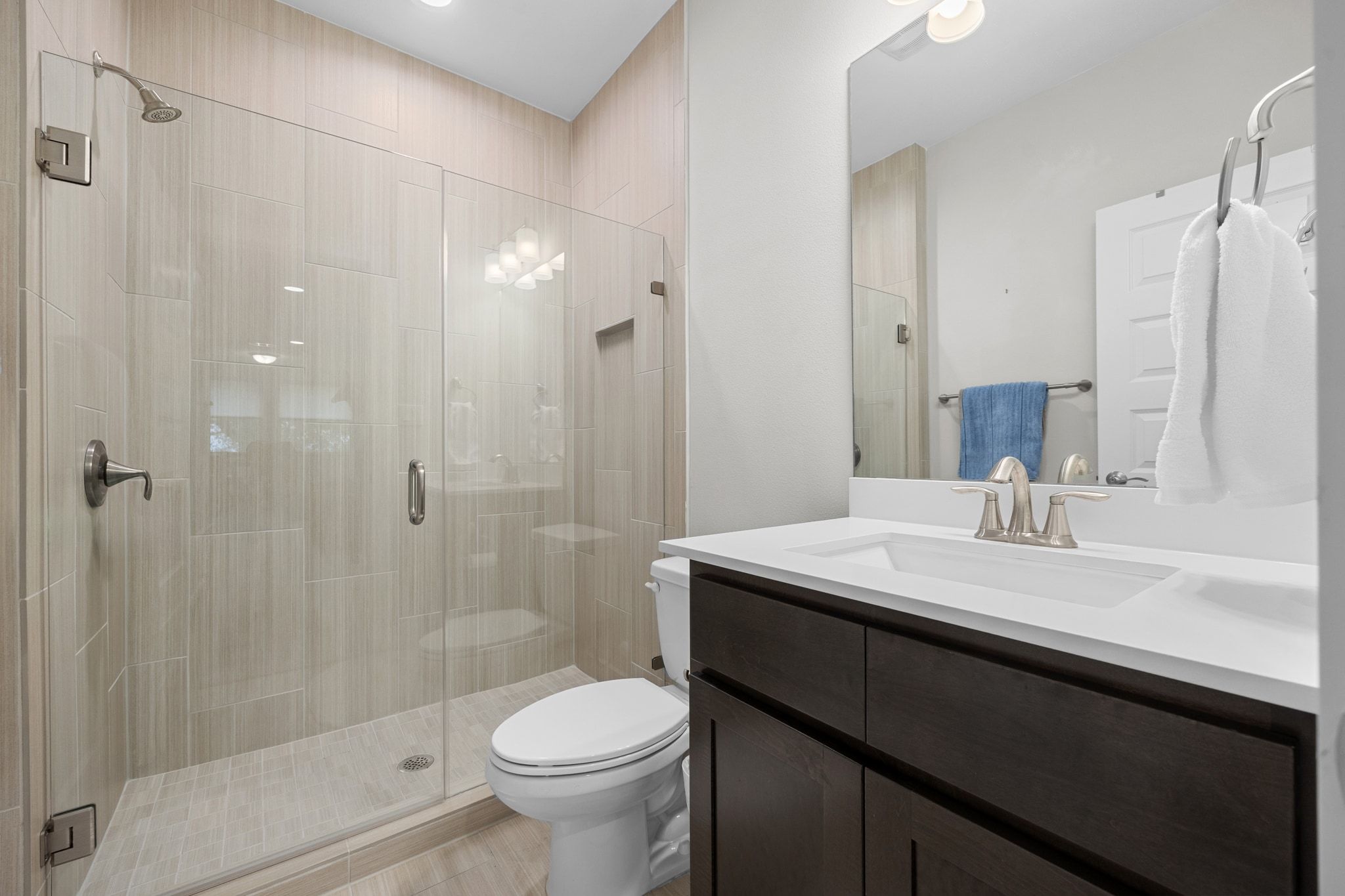 2009 Nature View Loop Driftwood, TX 78619 - Photo 24 of 40 a bathroom with a sink a toilet and shower