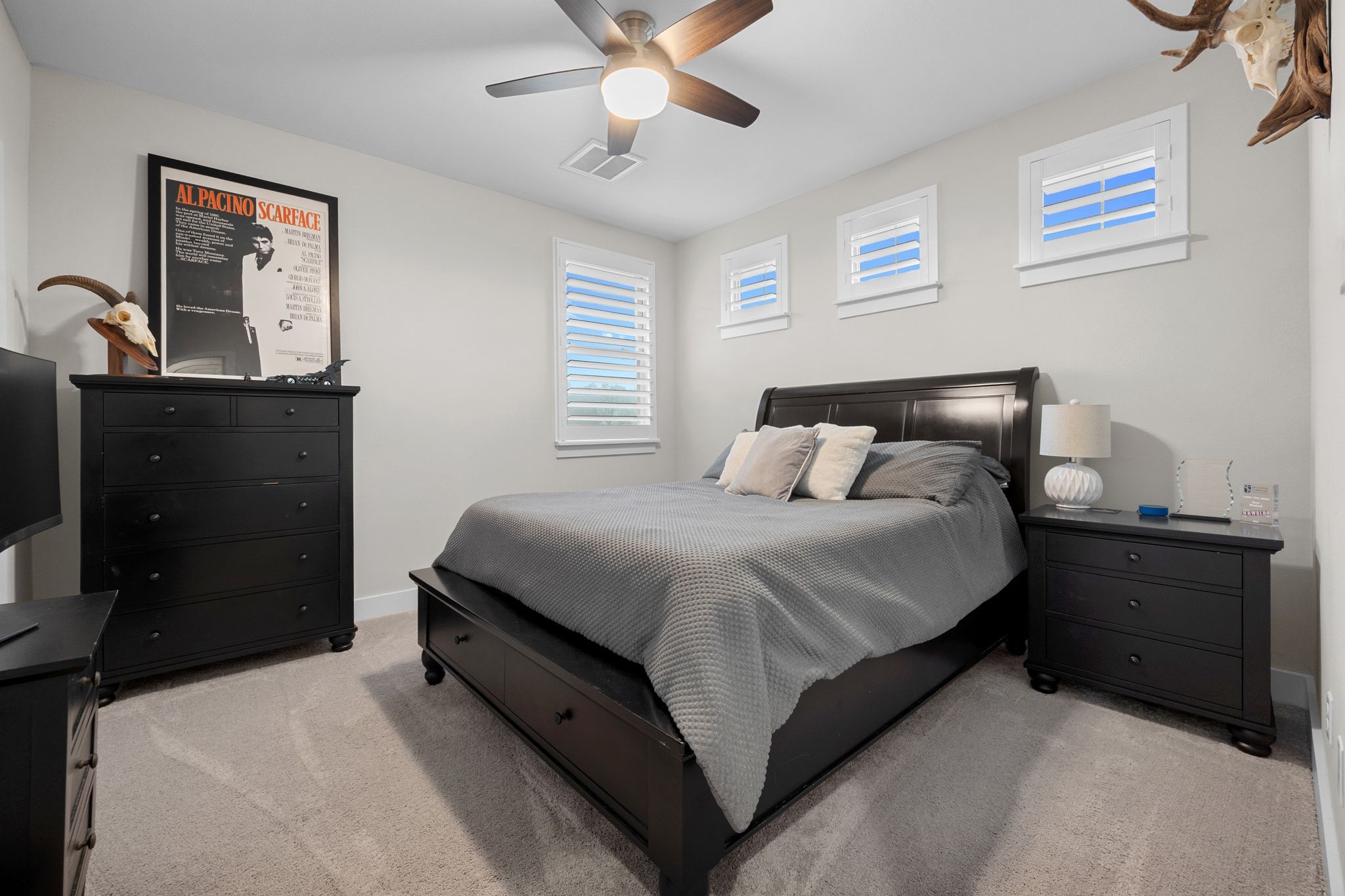2009 Nature View Loop Driftwood, TX 78619 - Photo 25 of 40 a bedroom with a bed and a chandelier