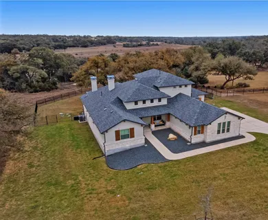 a bed room with a bed and a chandelier