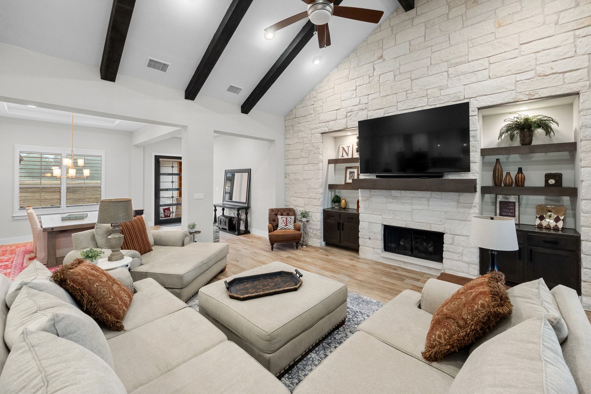 2009 Nature View Loop Driftwood, TX 78619 - Photo 3 of 40 a living room with fireplace furniture and a flat screen tv
