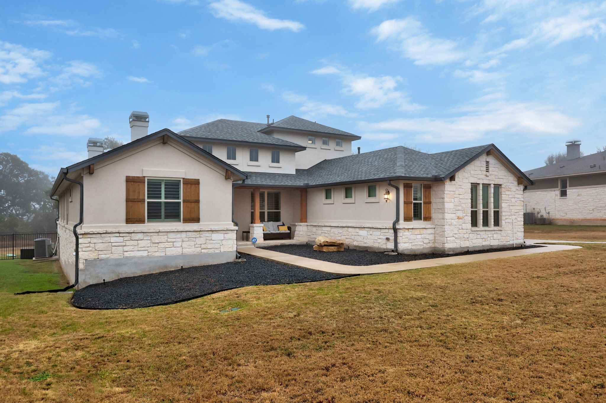 2009 Nature View Loop Driftwood, TX 78619 - Photo 32 of 40 a front view of a house with a yard