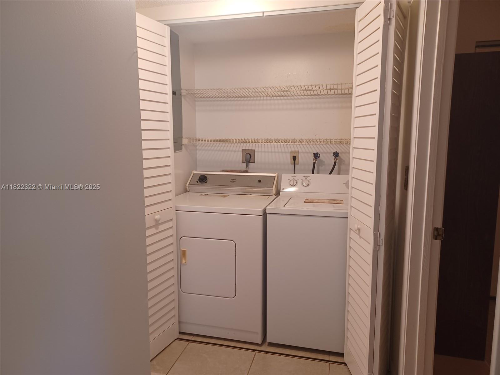 17000 Northwest 67th Avenue, Unit 126 Hialeah, FL 33015 - Photo 14 of 25 a utility room with dryer and washer