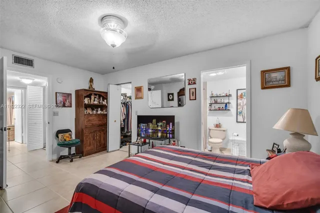 a view of a porch with furniture and garden