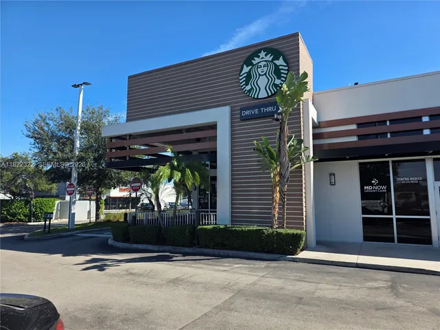 a view of parking space with parked cars
