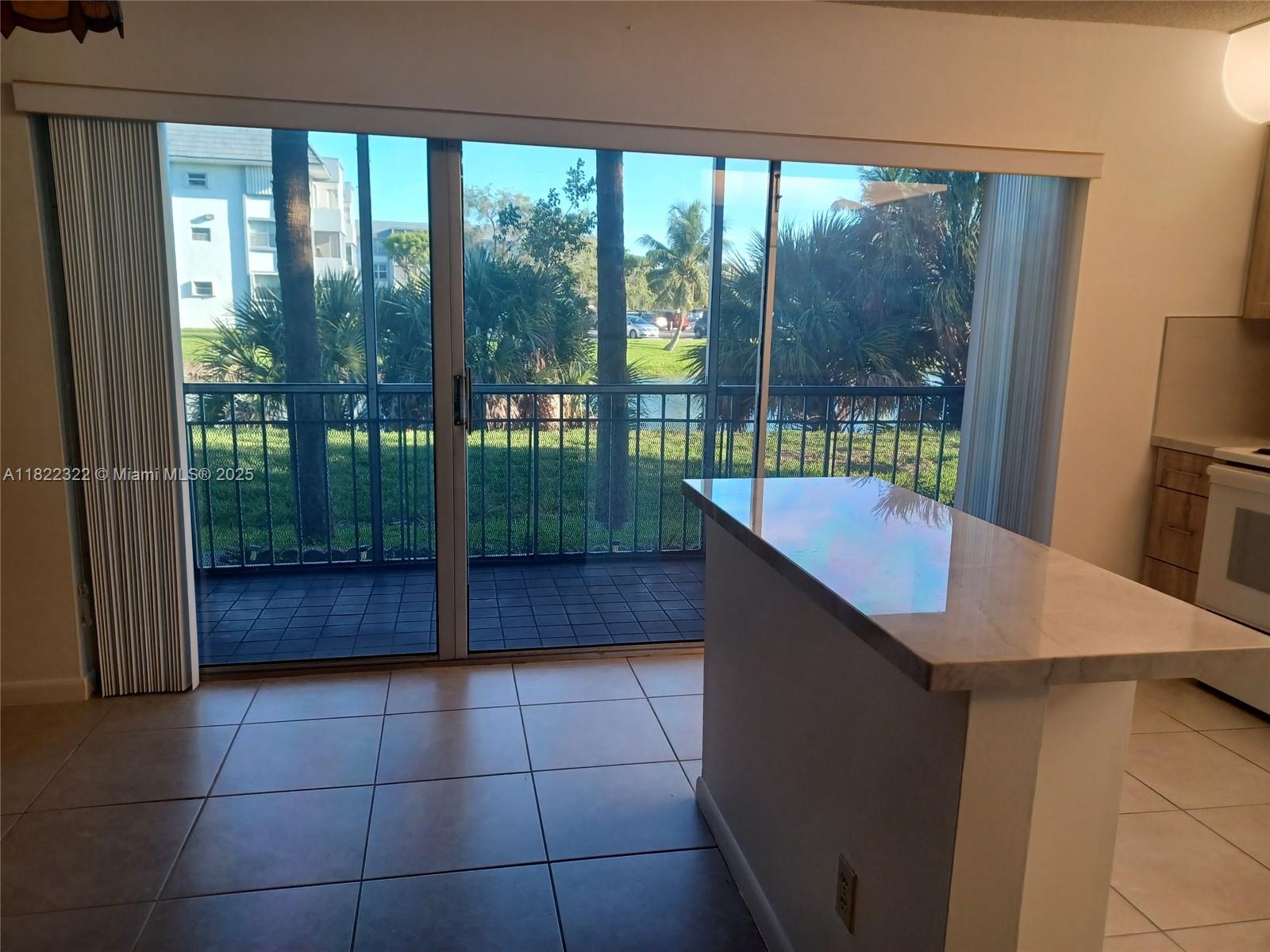 17000 Northwest 67th Avenue, Unit 126 Hialeah, FL 33015 - Photo 3 of 25 a kitchen with a sink and a counter top space