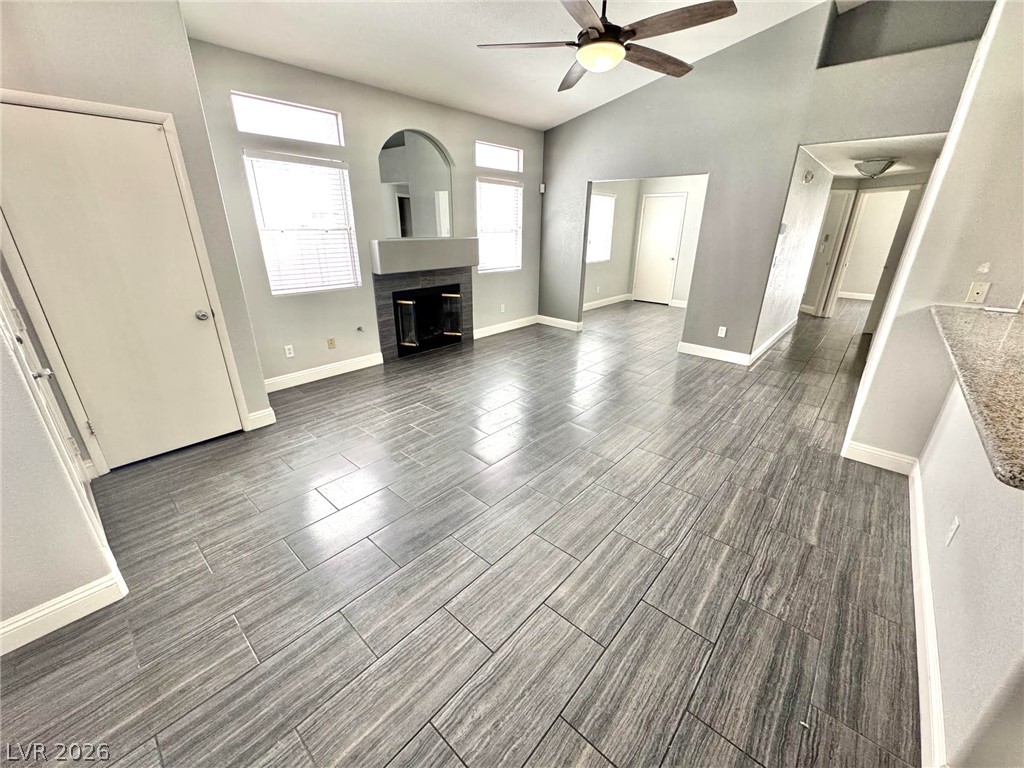 5304 Runningbrook Road Las Vegas, NV 89120 - Photo 2 of 22 Gleaming tile floors anchor this airy living area accented by a classic fireplace.