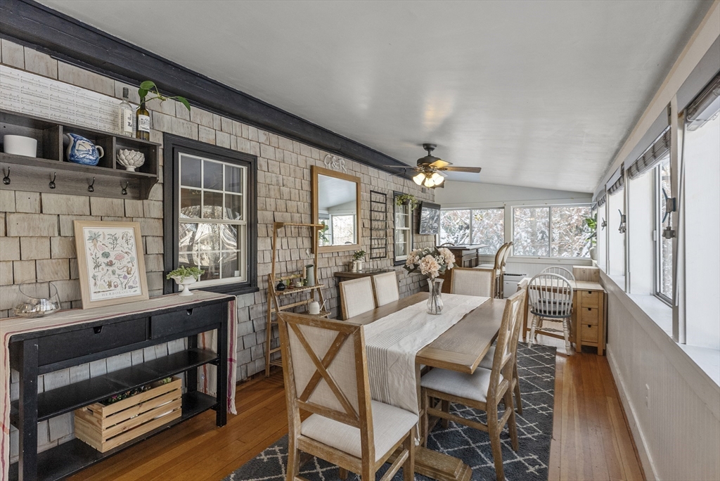 70 7 Hills Road Plymouth, MA 02360 - Photo 14 of 42 a view of a dining room with furniture window and wooden floor