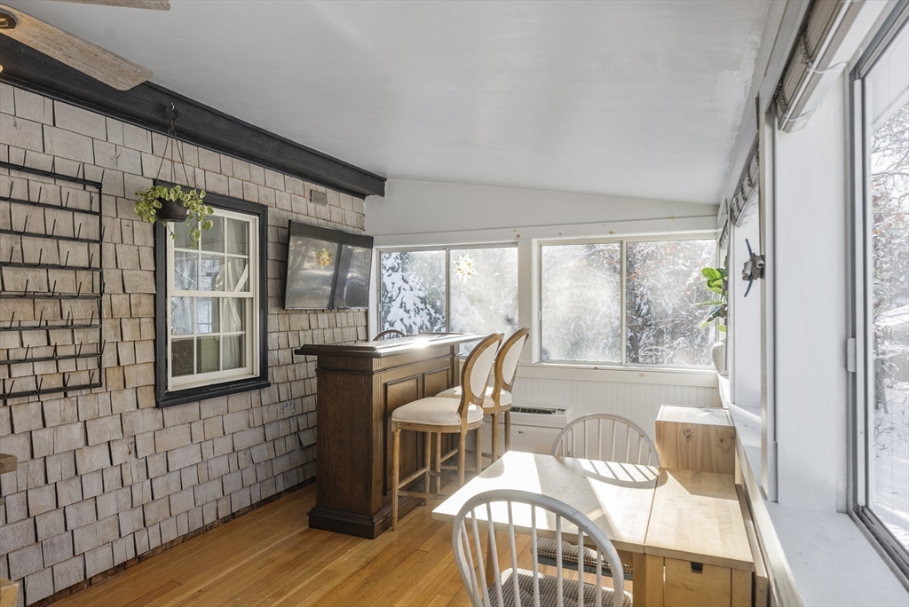 70 7 Hills Road Plymouth, MA 02360 - Photo 16 of 42 a view of a dining room with furniture window and wooden floor