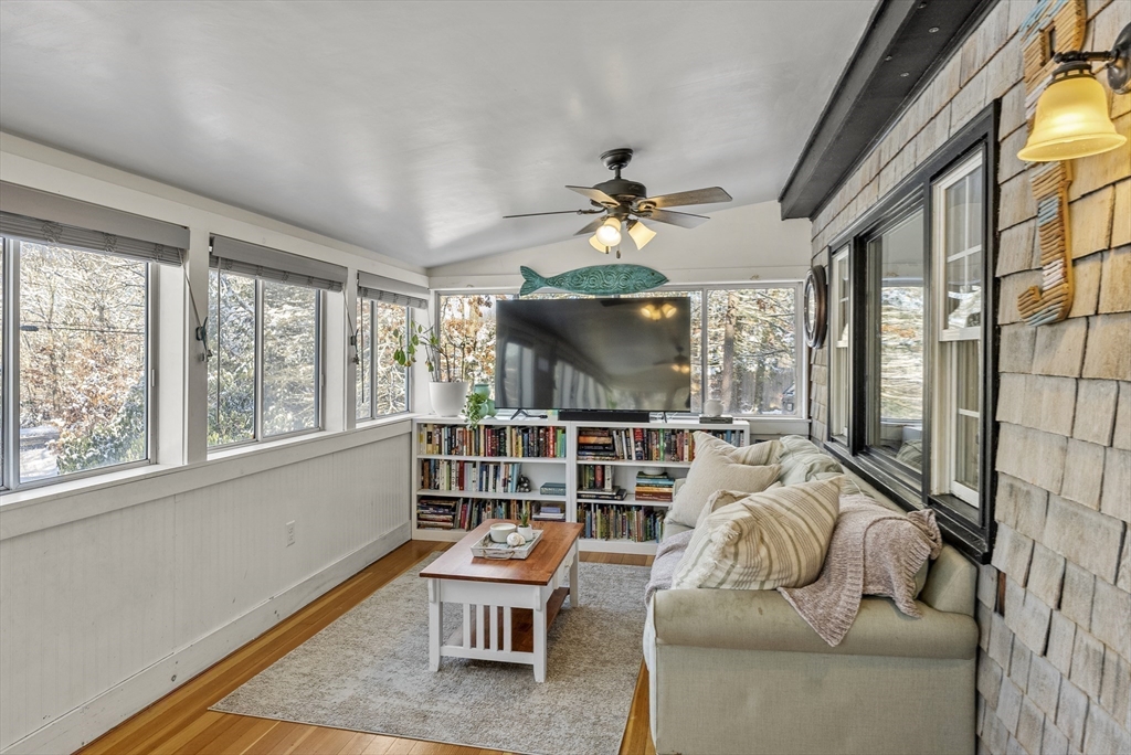 70 7 Hills Road Plymouth, MA 02360 - Photo 18 of 42 a living room with furniture a flat screen tv and a large window