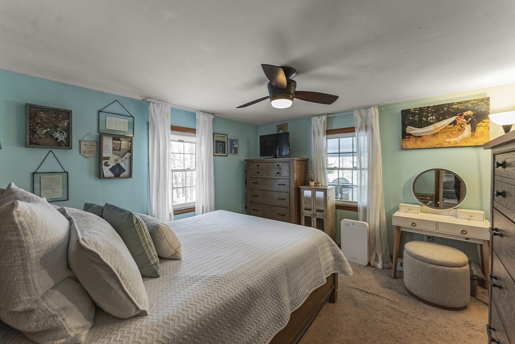 70 7 Hills Road Plymouth, MA 02360 - Photo 20 of 42 a bedroom with a bed and a flat screen tv