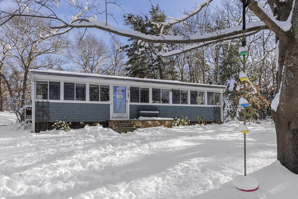 70 7 Hills Road Plymouth, MA 02360 - Photo 2 of 42 a front view of a house with a yard covered in snow