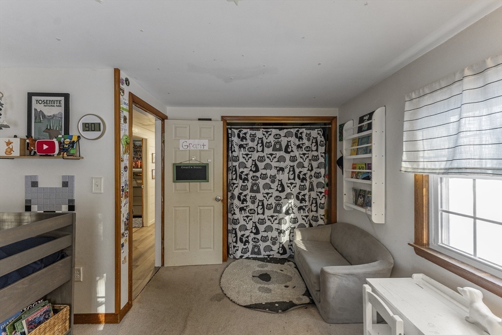 70 7 Hills Road Plymouth, MA 02360 - Photo 22 of 42 a living room with furniture and a window