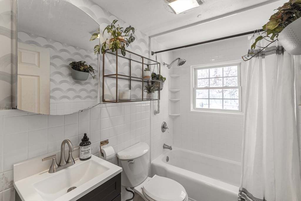 70 7 Hills Road Plymouth, MA 02360 - Photo 23 of 42 a bathroom with a sink toilet a mirror and shower