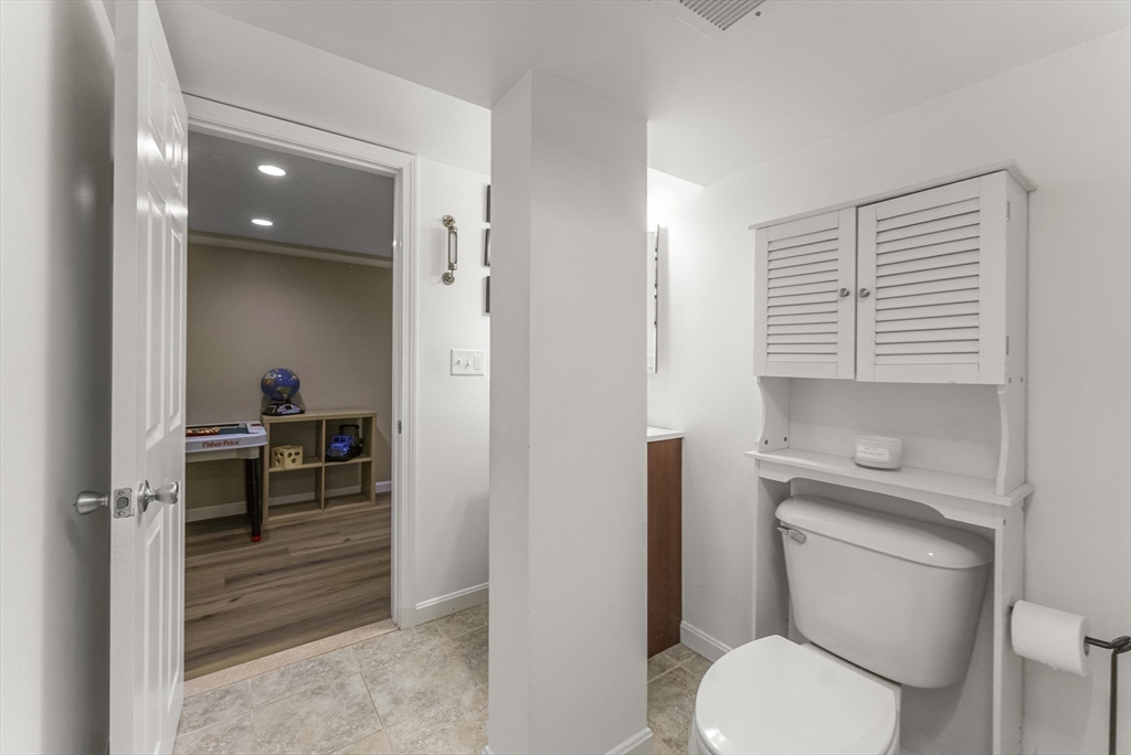 70 7 Hills Road Plymouth, MA 02360 - Photo 33 of 42 a en suite bathroom with a toilet a sink and a mirror