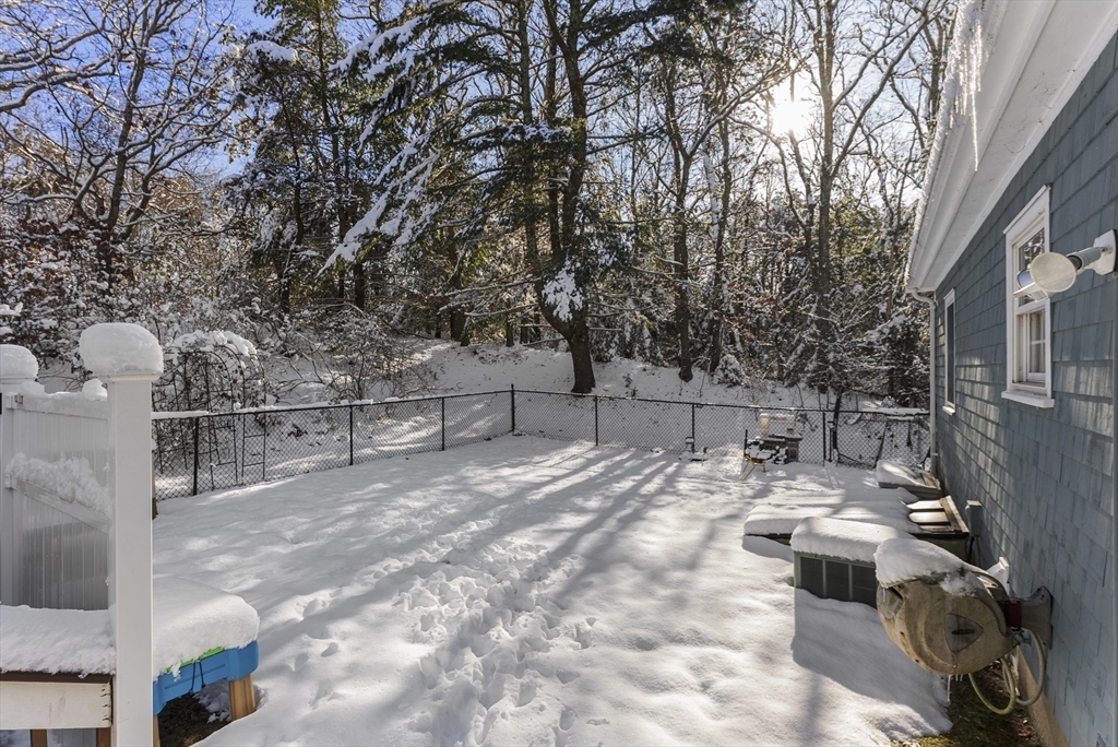70 7 Hills Road Plymouth, MA 02360 - Photo 37 of 42 a view of backyard with a table and chairs