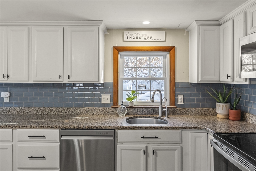 70 7 Hills Road Plymouth, MA 02360 - Photo 8 of 42 a kitchen with stainless steel appliances granite countertop a sink a stove and a granite counter tops