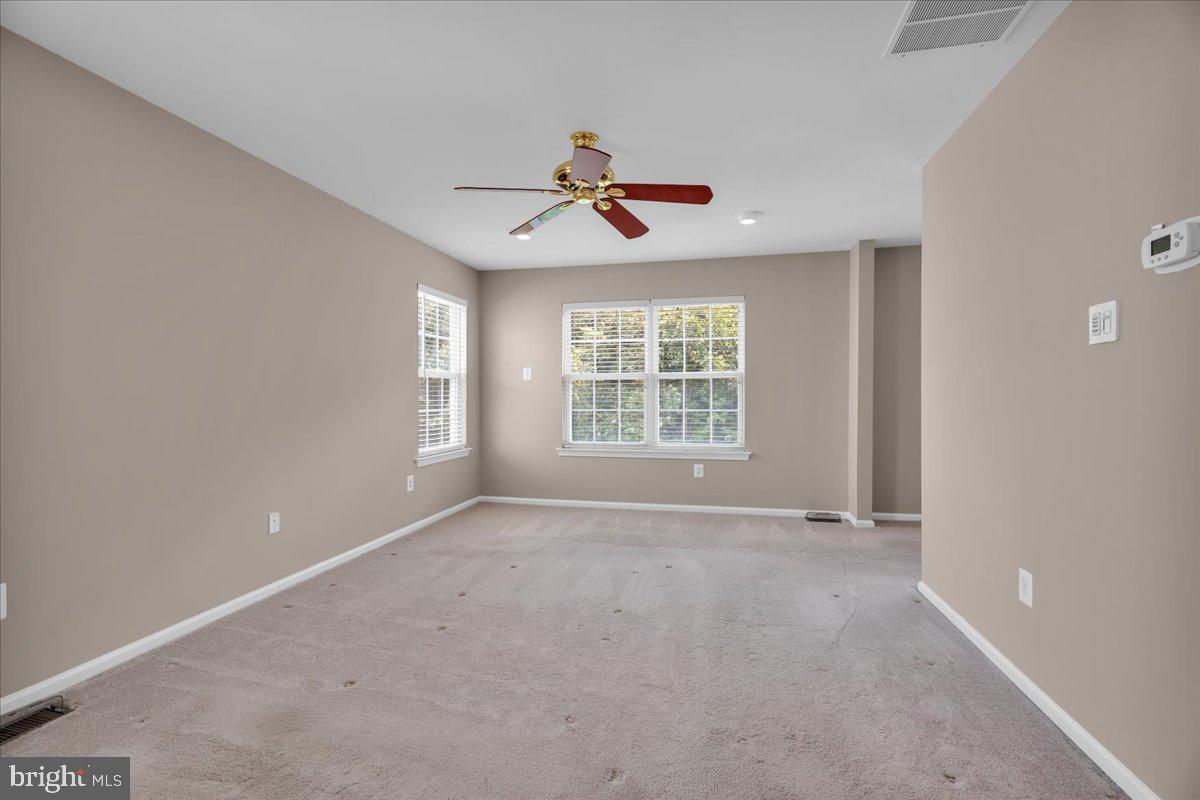 68 Hillside Lane Mount Laurel, NJ 08054 - Photo 23 of 36 an empty room with windows and fan