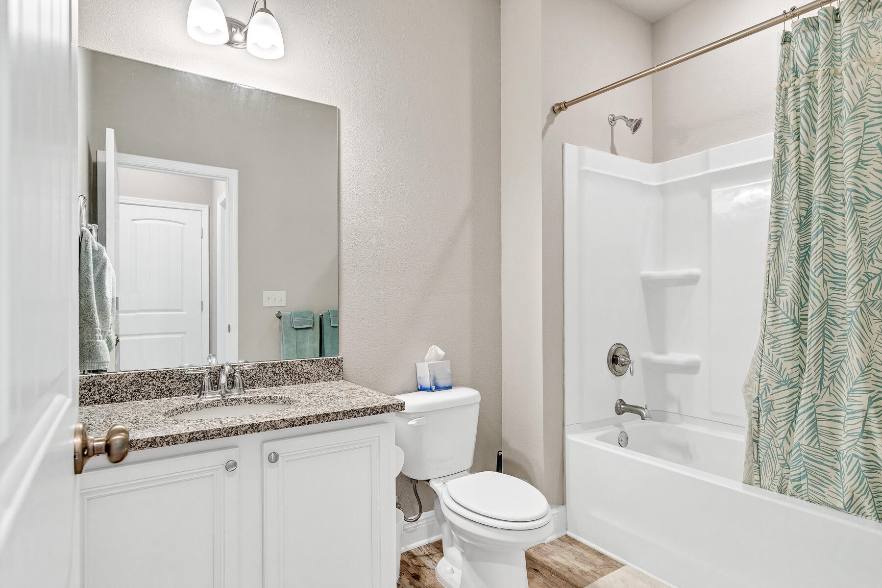 186 Southern Pnes Road Santa Rosa Beach, FL 32459 - Photo 26 of 32 a bathroom with a granite countertop sink a toilet and shower