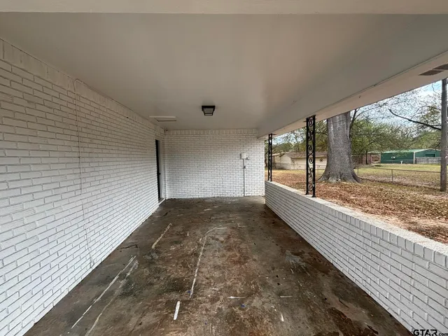 a view of a back yard from a balcony