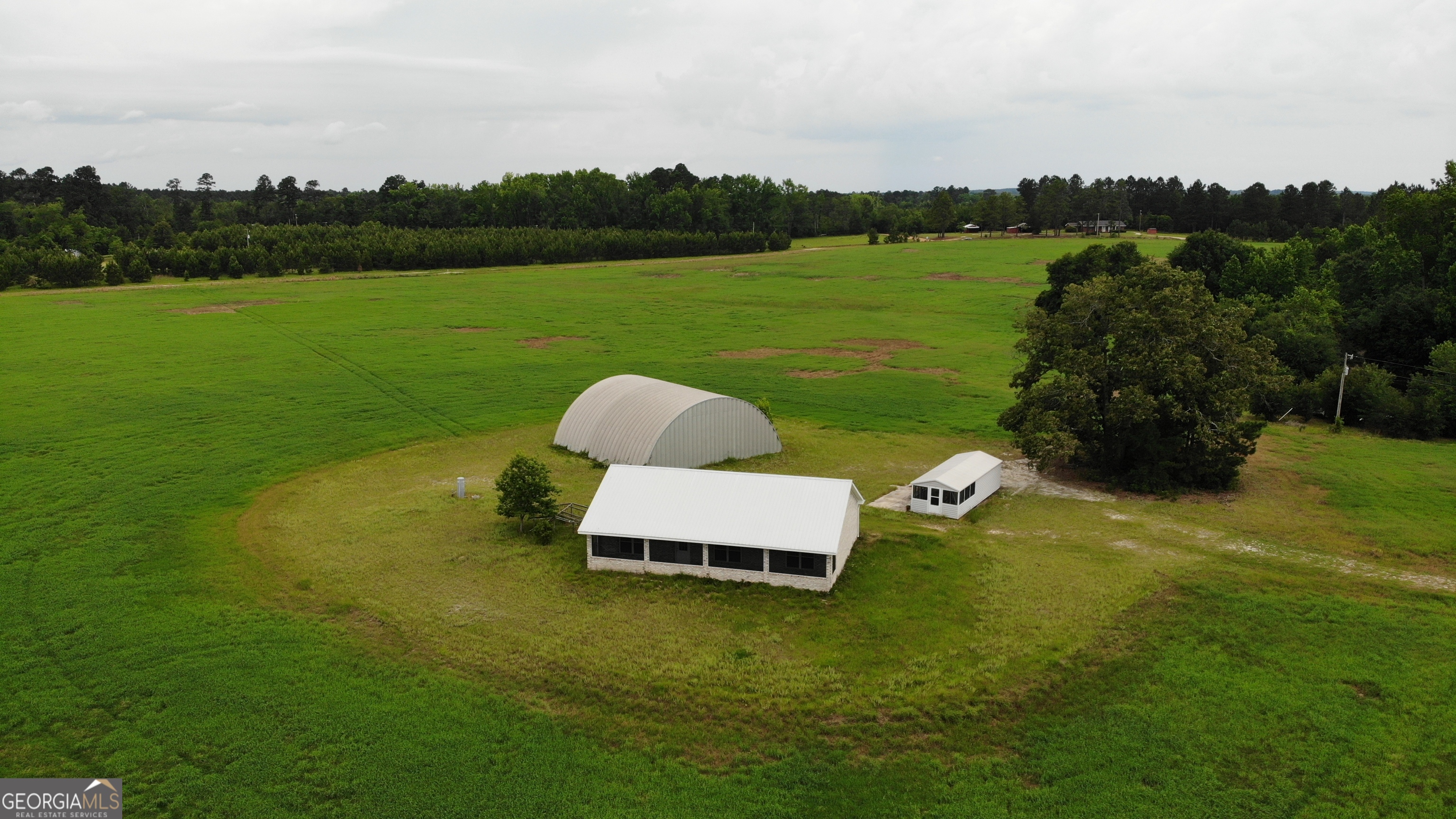 a wooden bench sitting in the middle of a lake