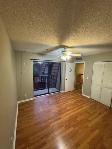 a view of an empty room with a fireplace