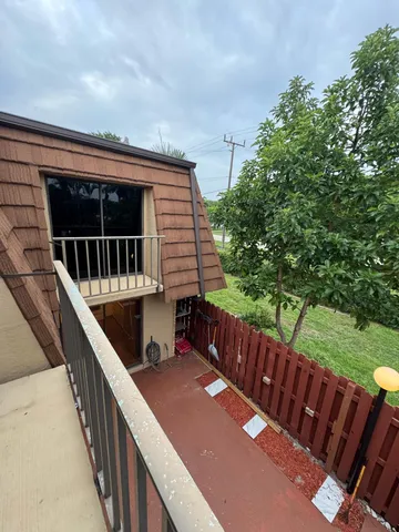 a balcony with wooden floor